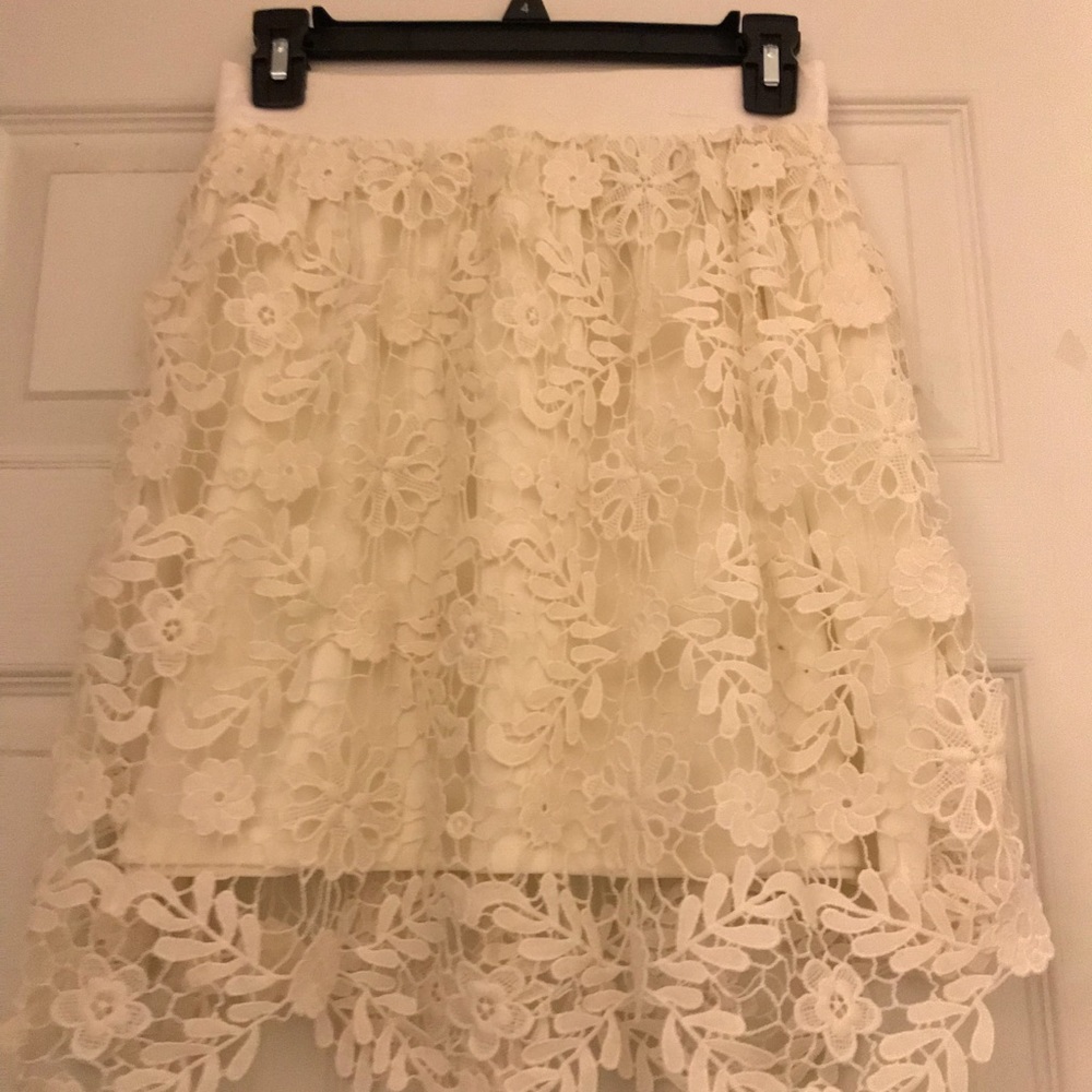 Ivory lace skirt with liner.